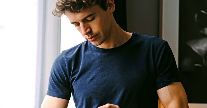 Man wearing dark blue shirt