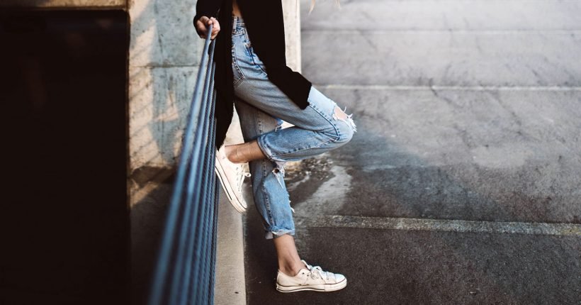 Person Standing with Foot on Rail
