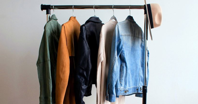 Clothes Hanging on Rail